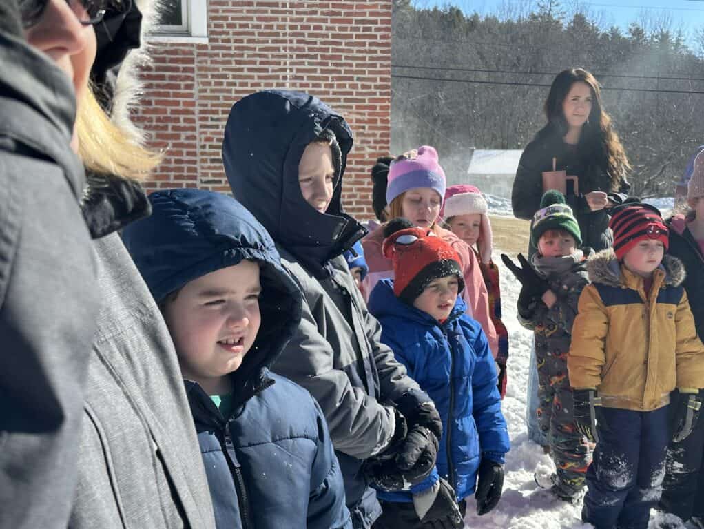 Students watching goat presentation