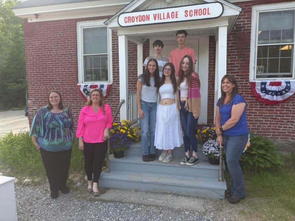 Seniors pose for a photo in front of CVS