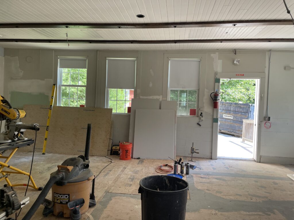 Interior of Croydon School District undergoing renovation with construction tools and materials present.
